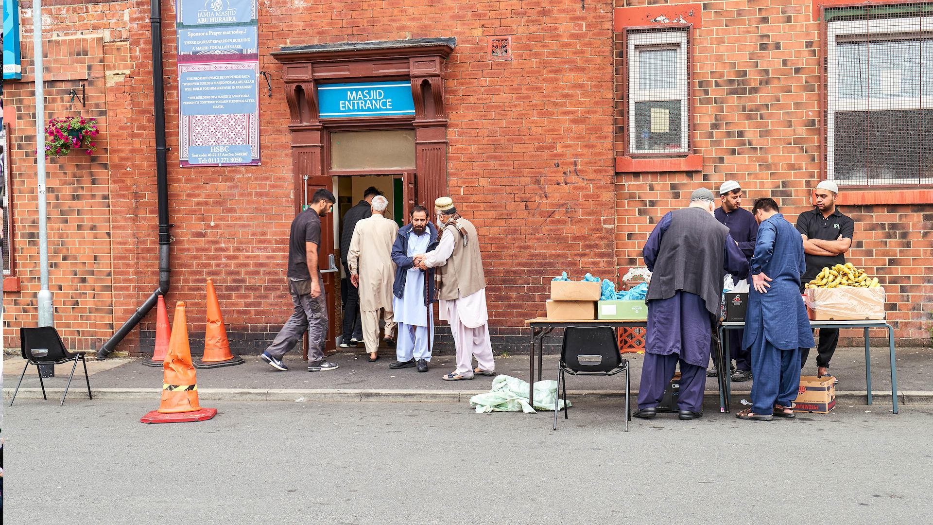 Group of men outside mosque